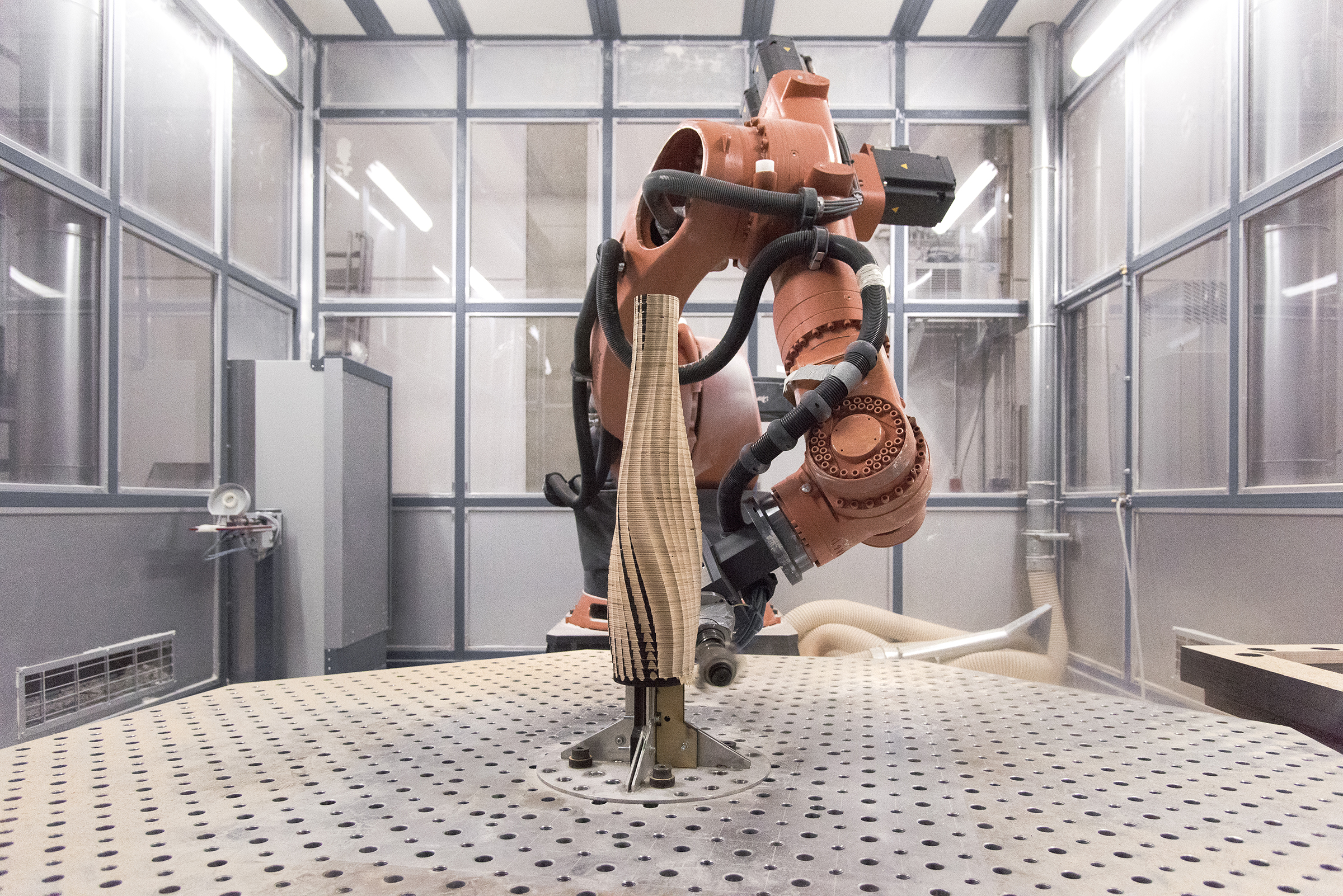 AESTUS blends material and machine: As a series of stratified wooden vases, AESTUS is designed and manufactured to explore a new synthesis of traditional materials and modern technology. Carved from hundreds of layers of wood by an industrial robot, the vases capture the fluidity of the machine's movements in the depth of the wooden texture.